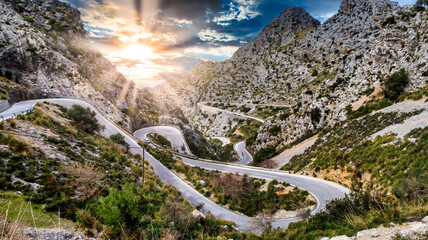 Serpentine Road with sunset and some cyclist at majorca, mallorca island