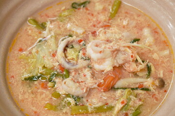 boiled seafood sukiyaki in soup with sauce