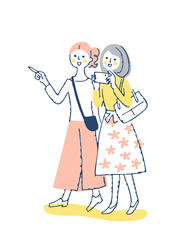 笑顔で歩く2人の女性