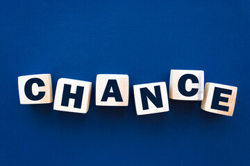 Obraz premium Chance inscription on wooden cubes on a blue background