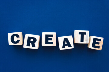 Obraz premium Create word on wooden cubes. Creativity development education concept.