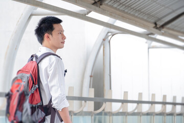 Asian traveler business man wearing face mask indeparture terminal in airport. Male passenger traveling by plane transportation during covid19 virus pandemic. vacation concept.