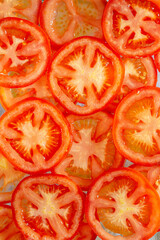 Macro Tomatoes,Tomato slices. Natural background with slices of tomato.
