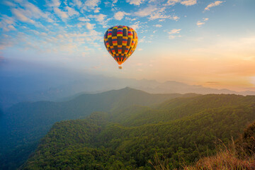 mountains and balloons,Colorful hot air balloons flying over mountain at Dot Inthanon in Chiang...