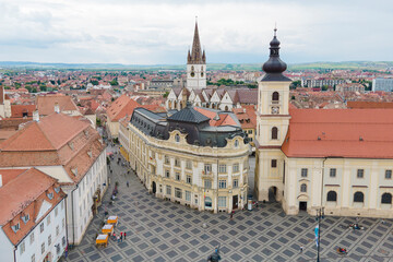 Fototapeta na wymiar Aerial view of ancient part of Sibiu in Romania, red roofs town in summer day