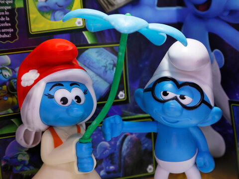 The smurfs. SmurfWillow and Philosopher. Smurfette from the movie The Smurfs and the Lost Village 3. Little blue creatures that live in mushroom houses. Album of figurines or stickers.