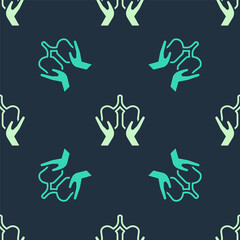 Green and beige Lungs icon isolated seamless pattern on blue background. Vector
