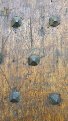 Close up of a medieval wooden door and iron rivets