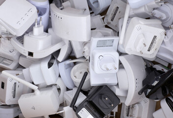 Heap of used home Wifi range extenders repeaters. Recycle wireless wi-fi electronic gadgets