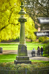 War memorial statue covered in moss in Stamford park Ashton Under Lyne