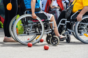Wheelchair users play boccia. Outdoor sports activities for people with disabilities....