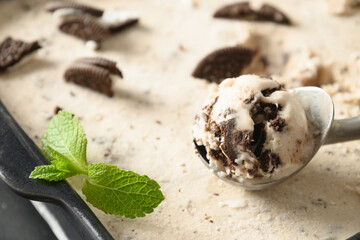 Homemade creamy and cookies ice cream in scoop. Close up. Tasty clean eating dessert without sugar.