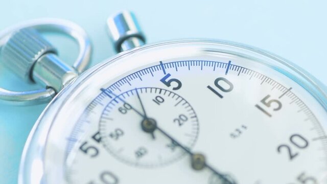 The second hand runs across stopwatch dial. Sport and time concept .