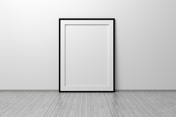 Mockup template of A4 frame with thin black frame border standing next to wall on wooden floor