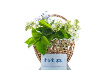 bouquet of white lilacs with a thank you card