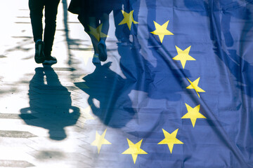 EU or European Union Flag and shadows of people, concept political picture. - obrazy, fototapety, plakaty