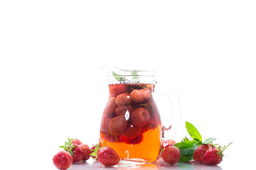 Sweet refreshing berry compote of ripe strawberries in a decanter