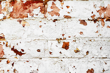 Texture of a brick wall with cracks and scratches which can be used as a background
