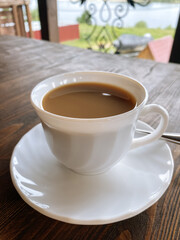 cup of coffee with milk on the terrace