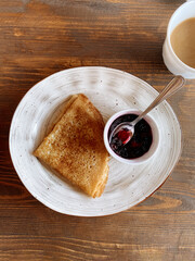 plate of russian pancake with jam