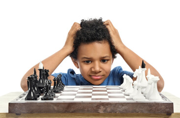 Cute African-American boy playing chess on white background