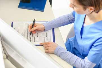 Female receptionist working in clinic