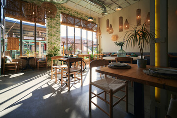 Interior of modern cafe with wooden furniture