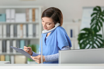 Female receptionist working in clinic