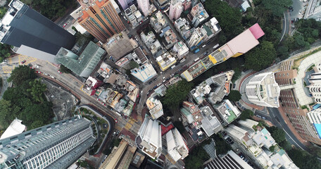Top view aerial photo from flying drone of a developed Hong Kong city with modern skyscrapers with...