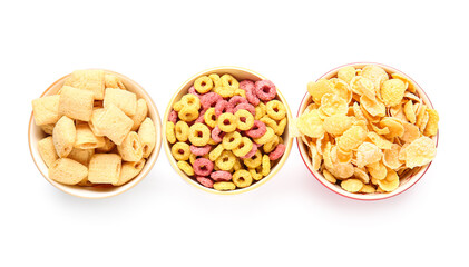 Bowls of different cereals on white background