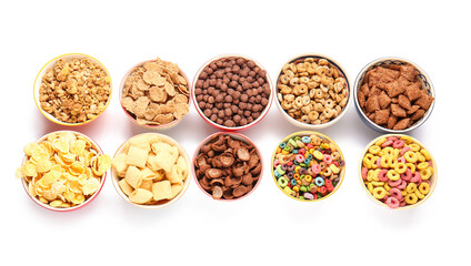 Bowls of different cereals on white background