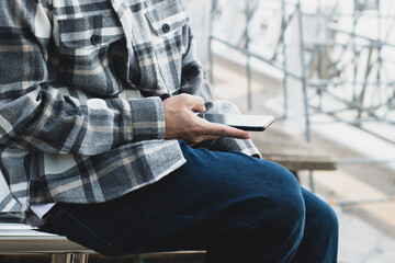 businessman hand finger touch on screen smartphone device for online trading network technology internet; mobile application