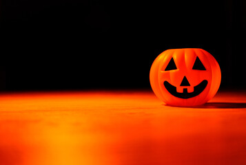 Halloween ball in black background, Orange light