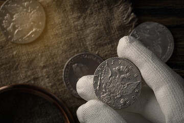 Numismatics. Old collectible coins of silver on the table.
