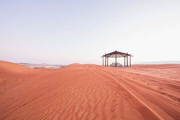 Desert camping and resting place with the lake and sand doom. sand pattern visible