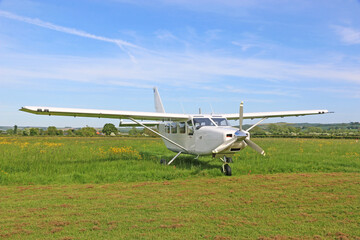 Fototapeta na wymiar Ultralight airplane on a grass strip 
