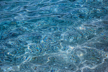Magic blue caustics on the sea surface