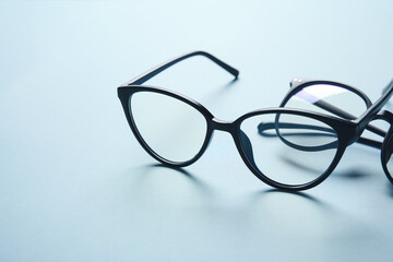 Fototapeta na wymiar Different stylish eyeglasses on color background, closeup