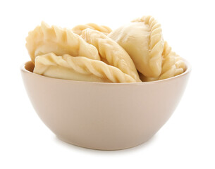 Bowl with tasty dumplings on white background