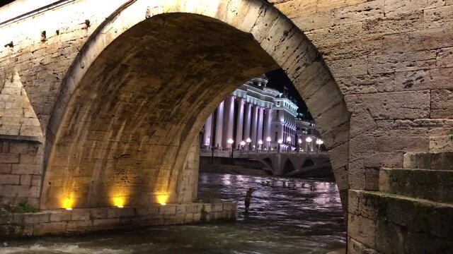 Stone Bridge, behind the Archeology Museum at night in Skopje, Macedonia. Stone Bridge is considered a symbol of Skopje.