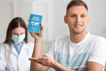 Young man with immune passport in clinic