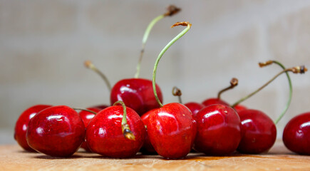 cherries in a bowl. cherries on a wooden table