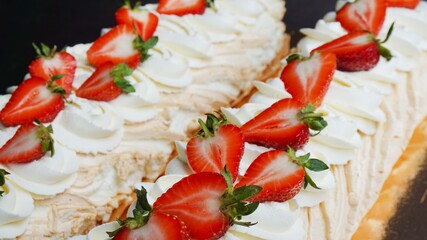 food dessert meringue roll with strawberries and butter cream