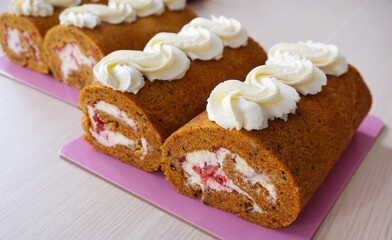 carrot roll with white butter cream and strawberries      