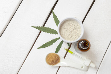 Top view of cannabis infused products - marijuana flour, sugar oil