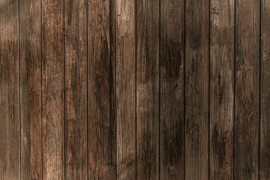 Drewniane brązowe tło, tekstura desek.