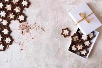 Chocolate cookies with cream packed in a white box, light background, copy space, holiday Chocolate Day, Christmas