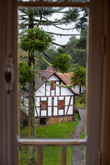 Old german looking farm house seen by the window on a rainning day, Rio Grande do Sul, Brazil