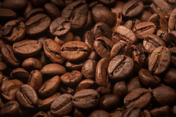 Dark roast coffee beans background. Top view.