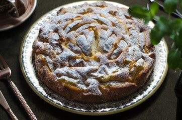 Pie with apples and almond petals